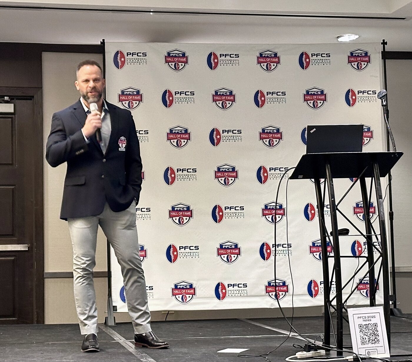 Dr. Joseph Krzemien giving his PFCS Hall of Fame induction speech, wearing the official HOF blazer, February 28, 2025